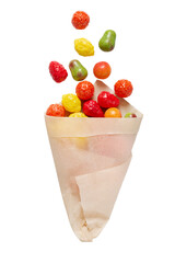 Fruit gummy candies in a paper bag isolated on white background. Levitation of sweets on a white...