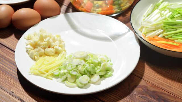 Chinese style home-cooked stir-fry with garlic sprouts and scrambled eggs