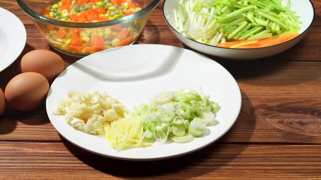 Chinese style home-cooked stir-fry with garlic sprouts and scrambled eggs