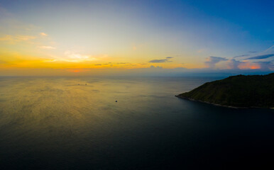 Fototapeta premium aerial view sunset above Nai Harn beach. Nai Harn beach is a fam