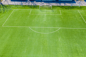 Obraz premium Aerial view of Sport concept of synthetic football or soccer fie