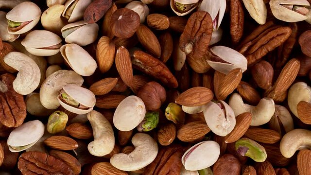 Super Slow Motion Shot of Moving Various Nuts, Filmed on High Speed Cinematic camera at 1000 fps.