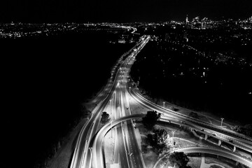 Aerial drone night shot of multilevel illuminated ring highway r