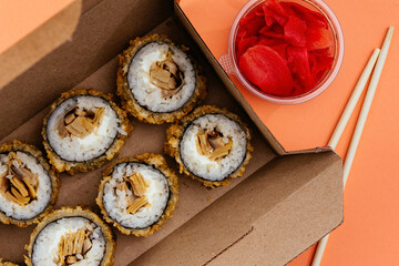 sushi rolls in a disposable container