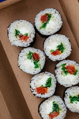 sushi rolls in a disposable container