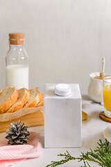blank half liter milk box packaging  with lid on a table with breakfast. package template,  mockup of a retail container for liquid products.