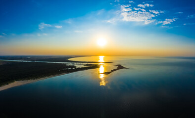 Obraz premium Minimalist aerial seascape - sunset over calm water