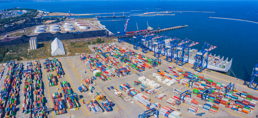 Aerial top view container cargo ship waiting for loading, import