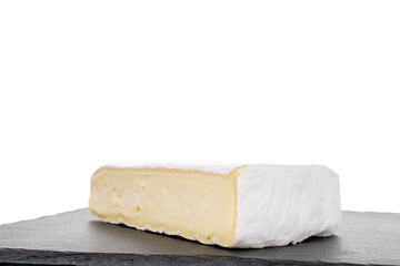 One fragrant piece of brie cheese on a slate stone, close-up, isolated on white.