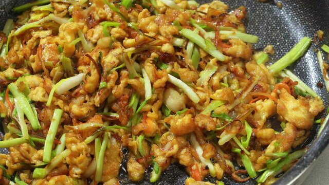 Chinese style home-cooked stir-fry with garlic sprouts and scrambled eggs