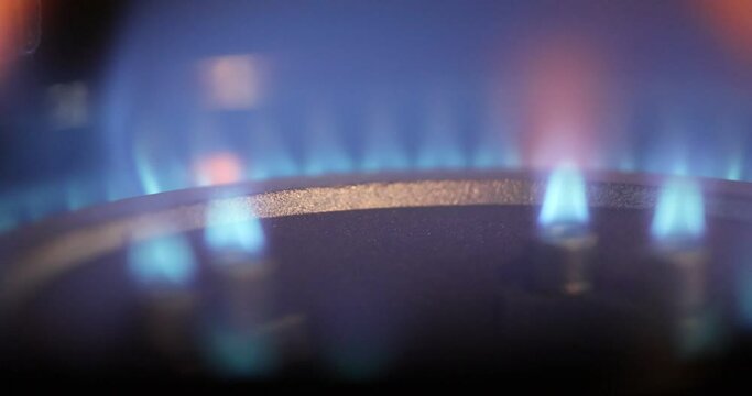 Combustion, extinction and ignition of gas in a household gas stove. Natural gas combustion is blue.