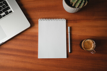 Notepad on vintage table, blank sheet, coffee, top view, template