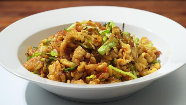 Chinese style home-cooked stir-fry with garlic sprouts and scrambled eggs