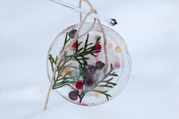 Handmade by children colorful natural christmas tree, new year decorations. Frozen berries and nuts...