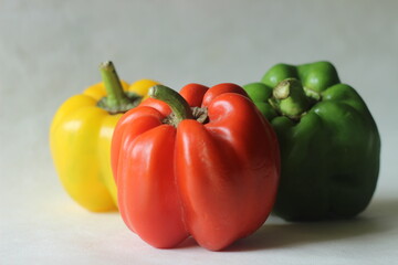 Red yellow and green bell peppers. Bell pepper or Capsicum annuum, also called sweet pepper or capsicum