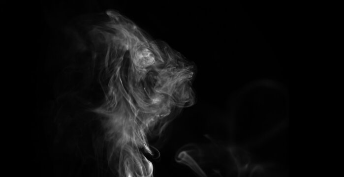 Smoke effect on a black background. Fog or mist texture, abstract and flowing