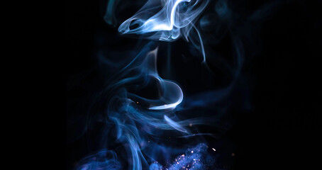 Abstract candle smoke on a black background. Colored fog texture photo