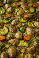 Oven baked vegetables in a baking dish. Vegetable dish close-up. Assorted vegetables roasted with spices, vegan recipe, copy space