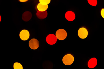 Red bokeh lights background, blurred christmas lights for holiday decoration
