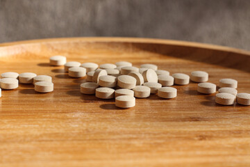 Obraz na płótnie Canvas Group of white pills on the table. Medical healthcare theme