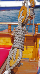 Fototapeta premium Old wooden block with rope