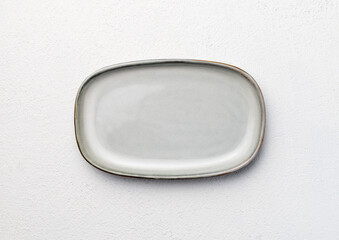 empty oval plate on white background