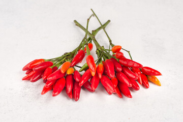Red hot chilli pepper on a white textured background, ingredients for spicy food, copy space for...