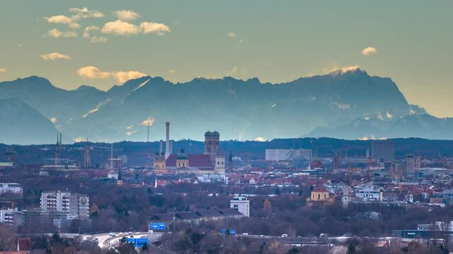 Munich skyline downtown in background alps mountains zugspitze winter snow. Munich germany frauenkirche church, cathedral marienplatz.