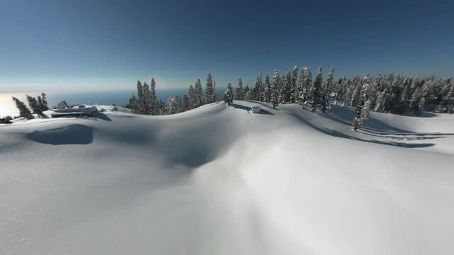 View from above sports fpv drone Abkhazia Mamdziskha mountain flying between snowy fir trees with Black Sea scenery. Group tourists people leisure recreational activity at countryside wild landscape