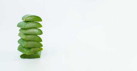 sliced pieces of aloe leaf on a light background, for banners