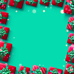 Christmas red gift box on green background with confetti and bokeh.
