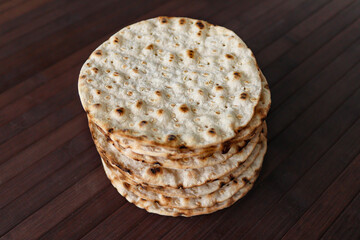 Stack of round crispbreads on wooden background