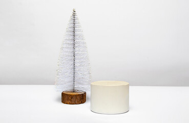 Happy New Year and Merry Christmas, beautiful podium decorated with a Christmas tree, close-up on a white background.
