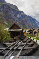 Fototapeta na wymiar Viking ship and viking houses on viking village