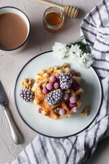 Waffles with fresh fruit and hot chocolate. Sweet and delicious snack or breakfast for those with a sweet tooth