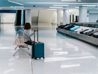 Girl waiting in baggage claim
