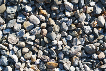 The texture of coarse gravel in full screen as a background.
