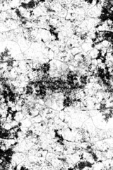 Rough black spots and cracked texture on the concrete floor