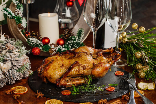 Christmas dinner with duck and apples, festive table setting, New Year.