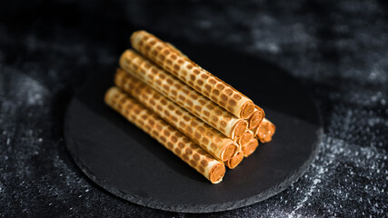 Homemade waffles on a black plate