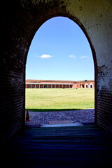 Fort Pulaski National Monument in Savannah, Georgia. American Civil War fort, Confederate Army surrendered fort to Union after rifled cannon siege. Arched opening looking out onto parade grounds.