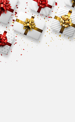 White gift boxes with red and golden bows.