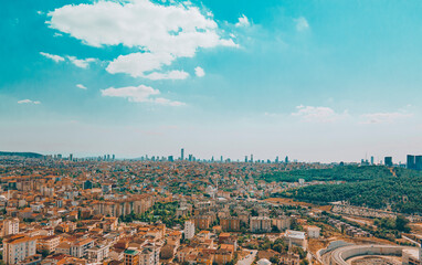 Fototapeta premium Istanbul downtown aerial drone panorama view at day time with skyscrapers and city skyline. Urban city life under beautiful sky.