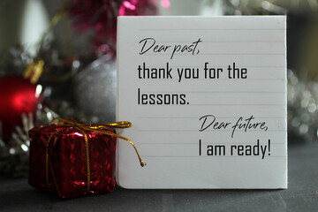 Dear past, thank you for the lessons. Dear future, i am ready. A self letter on a notepaper and red...