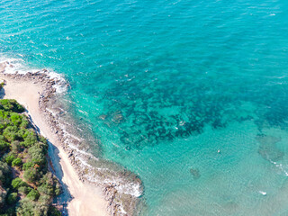 Coastal view of beautiful Aegean sea and seashore. Aerial drone view of summer landscape with blue sky.