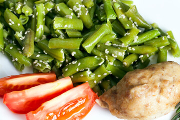 baked asparagus beans with sesame seeds and meat cutlet