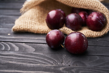 plums fruits natural products on a wooden table top view