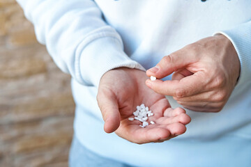 Heartache medicine. Pill in shape of heart against heart pain