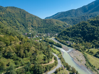 Beautiful drone view of the summer landscape of mountains, countryside, mountain river on a sunny day, Georgia