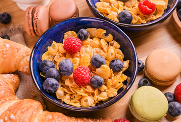 Breakfast cornflakes and macaroon cookies. Delicious and hearty breakfast close-up. High quality photo